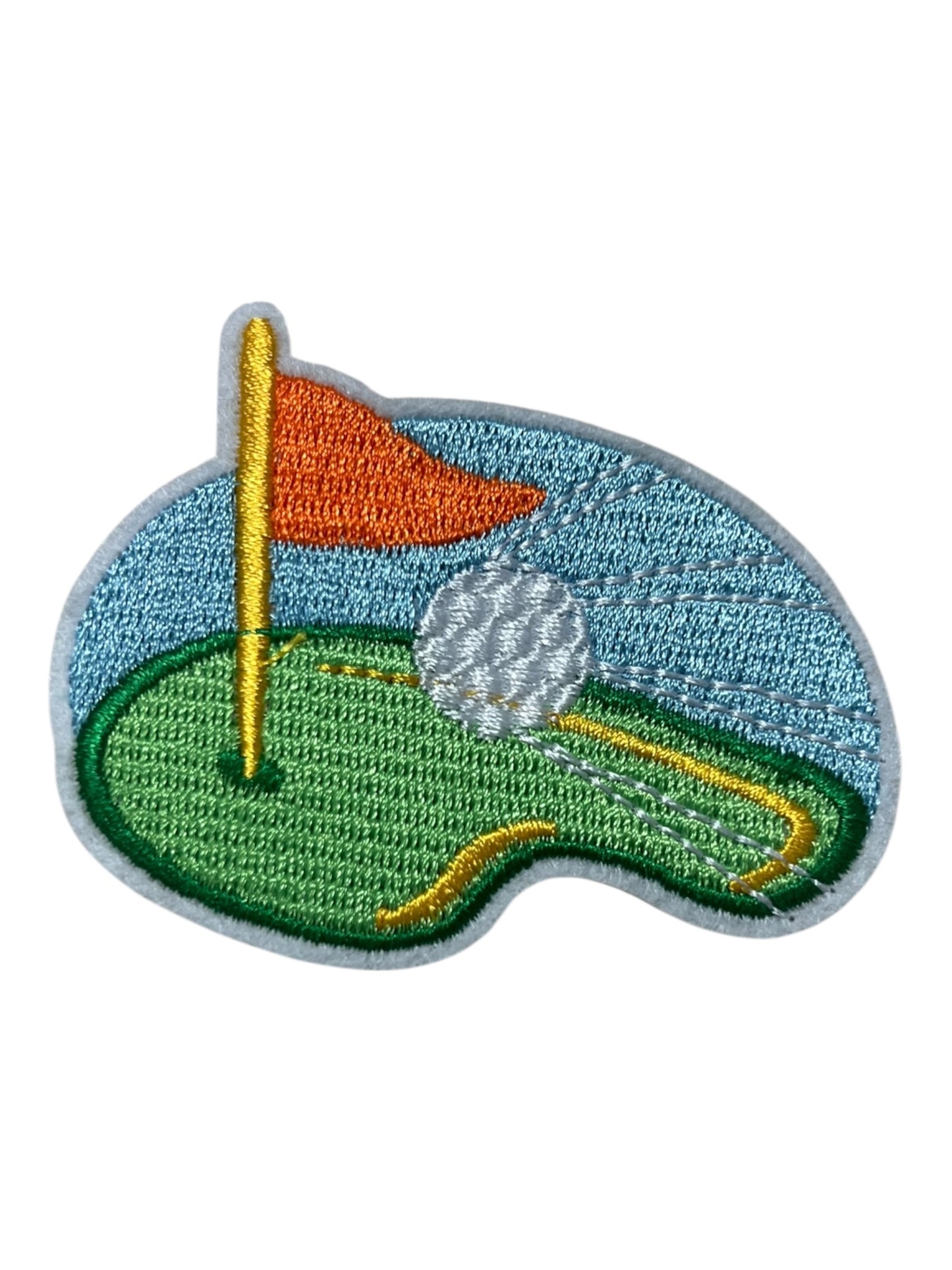 Golf green with ball orange