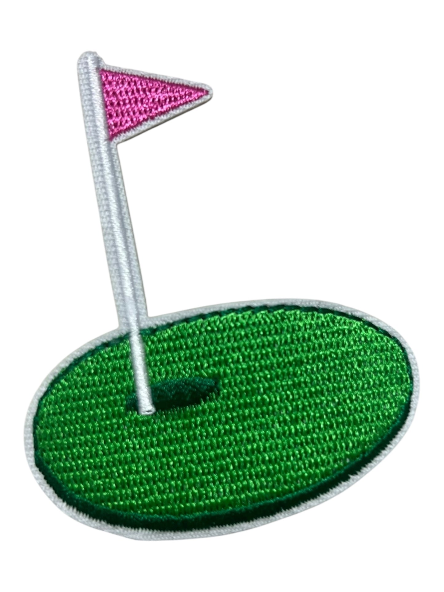 Golf green pink flag