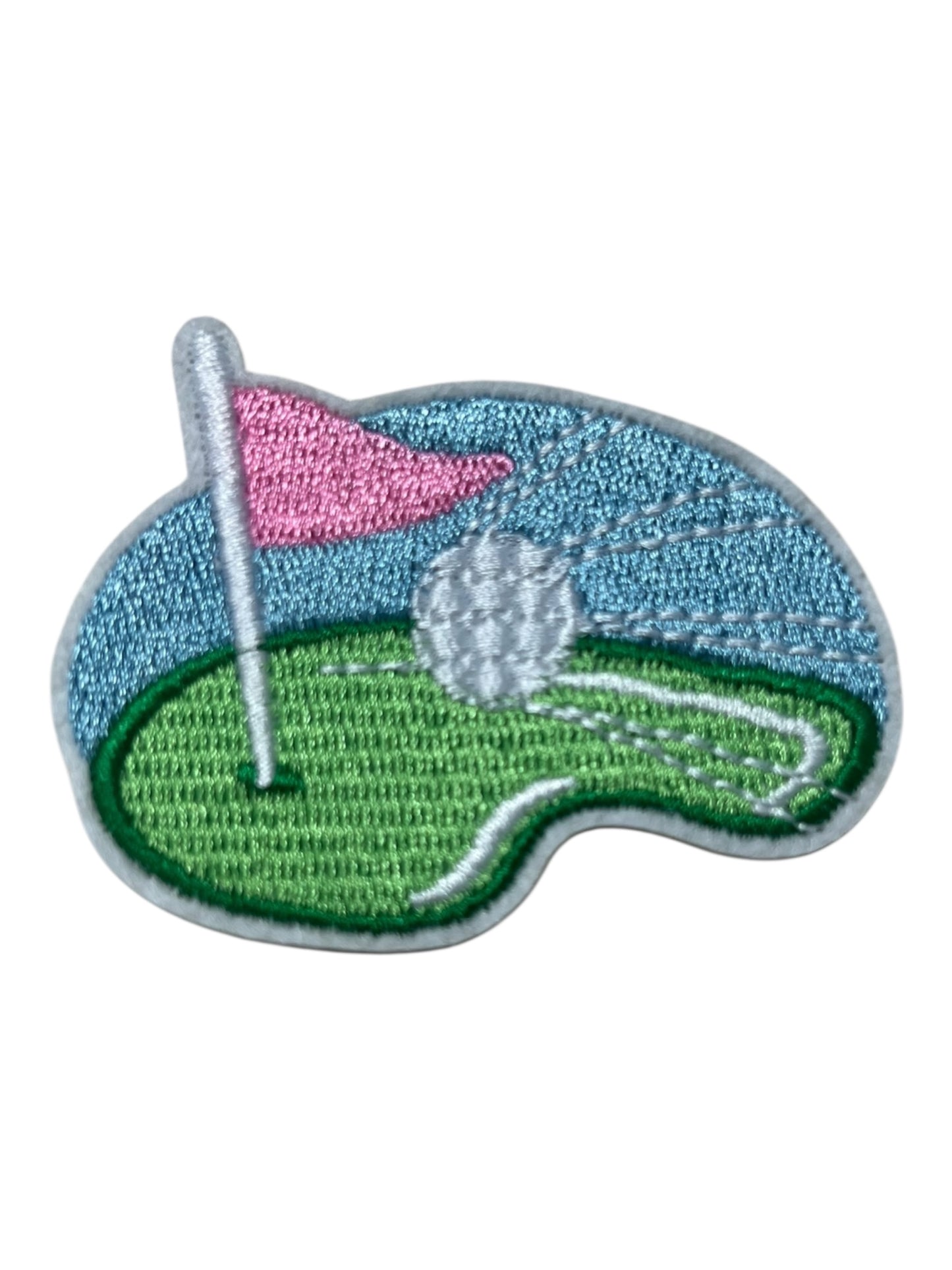 Golf green with ball pink