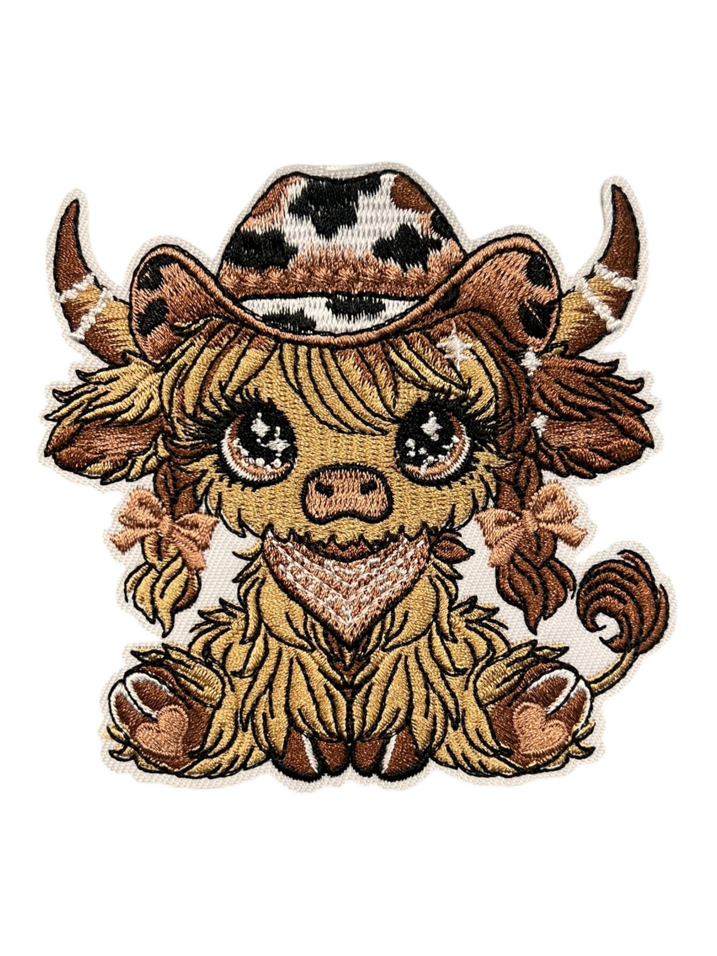 Cowgirl cow with brown and black accessories