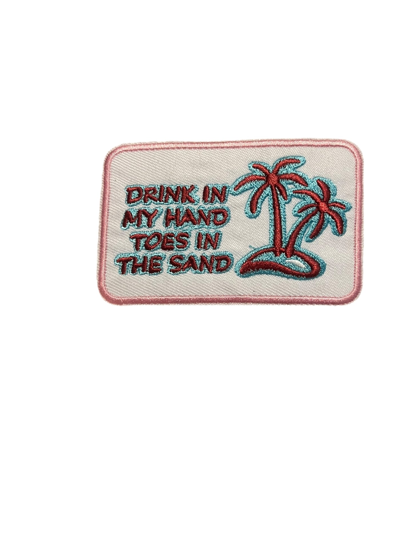 Drink in my hand toes in the sand