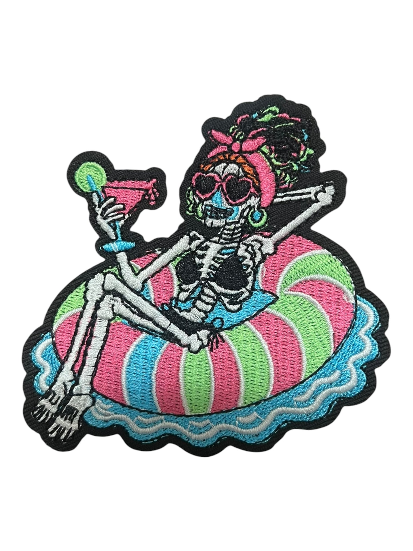 Skelly on a floatie with drink