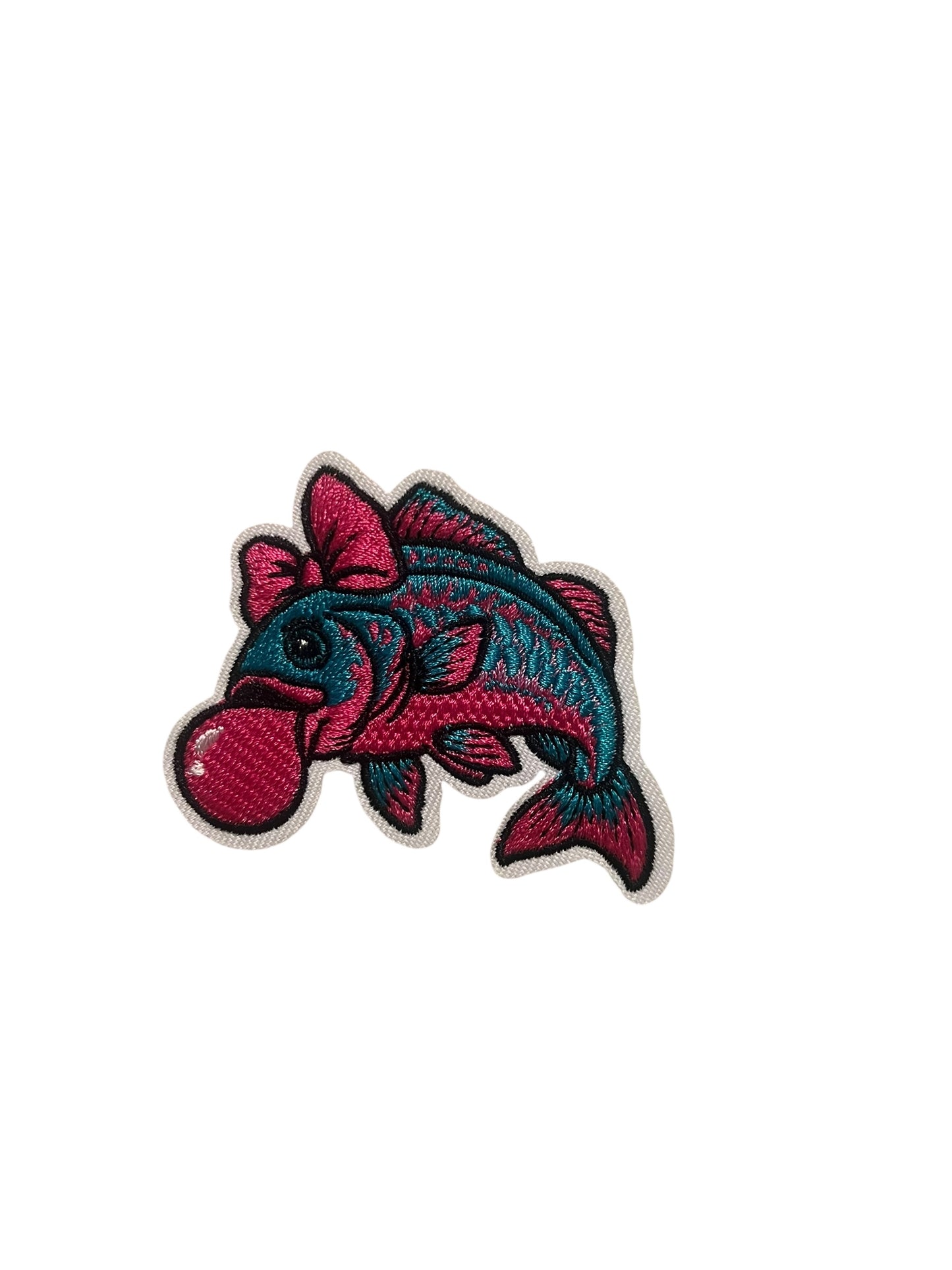 Pink and turquoise fish blowing bubble