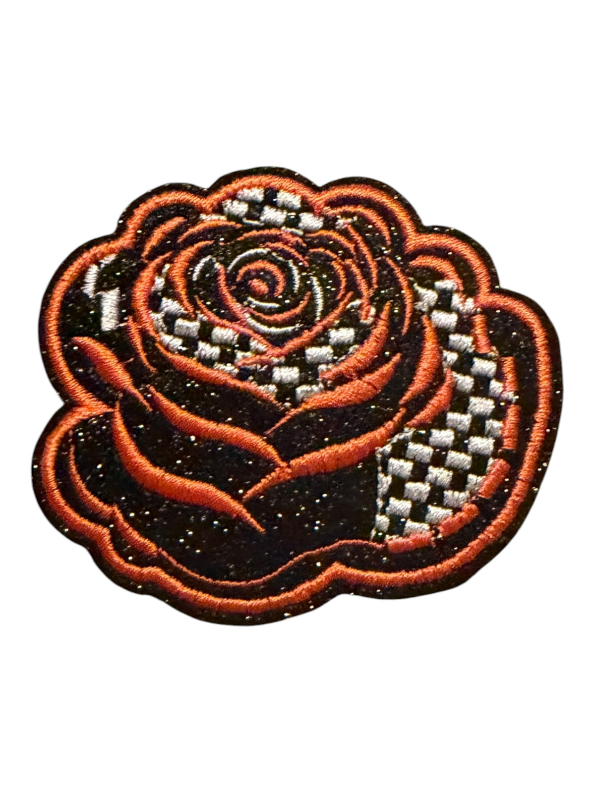 Black and white checkered rose with orange