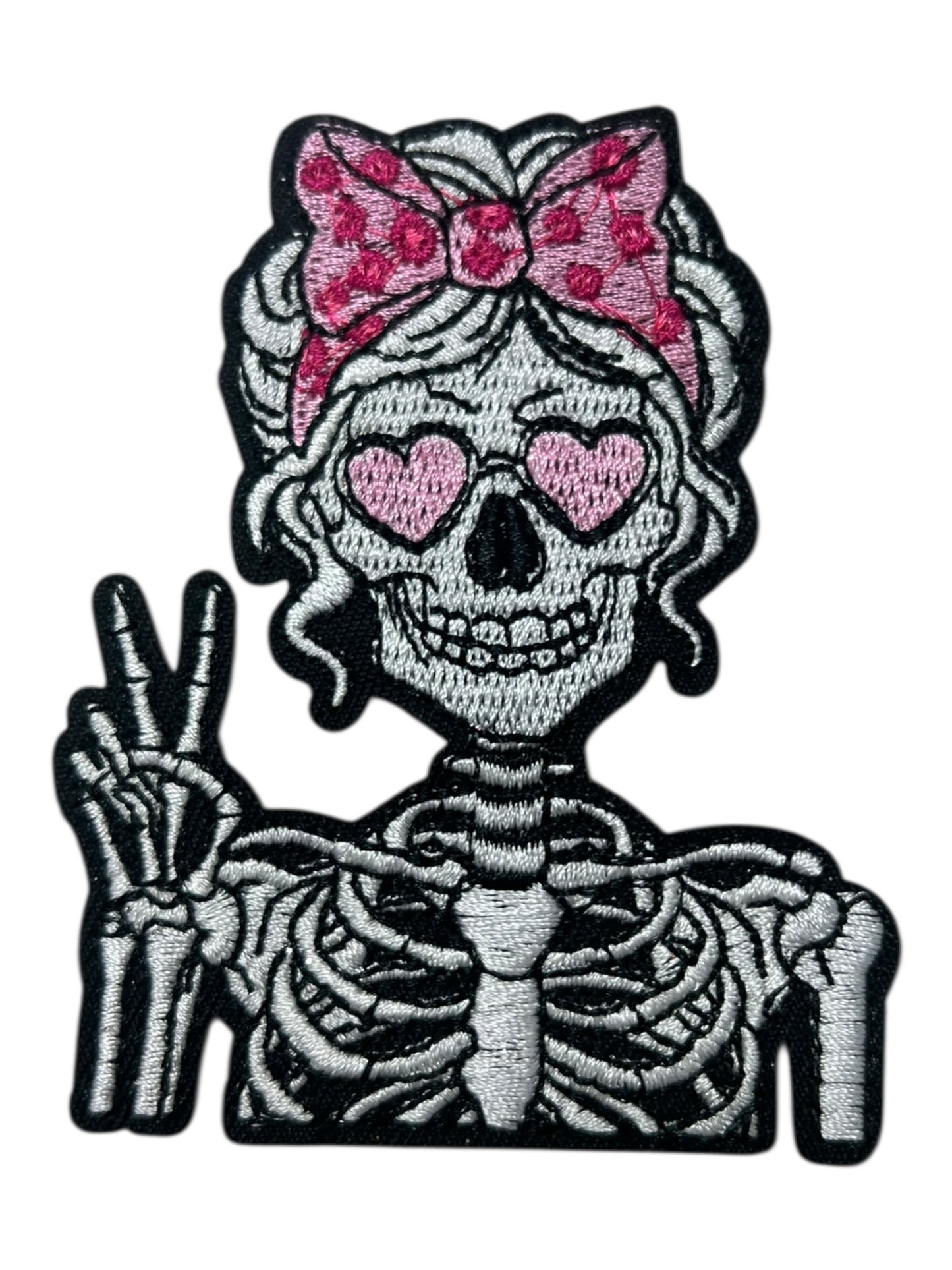 Skelly girl pink bow peace sign