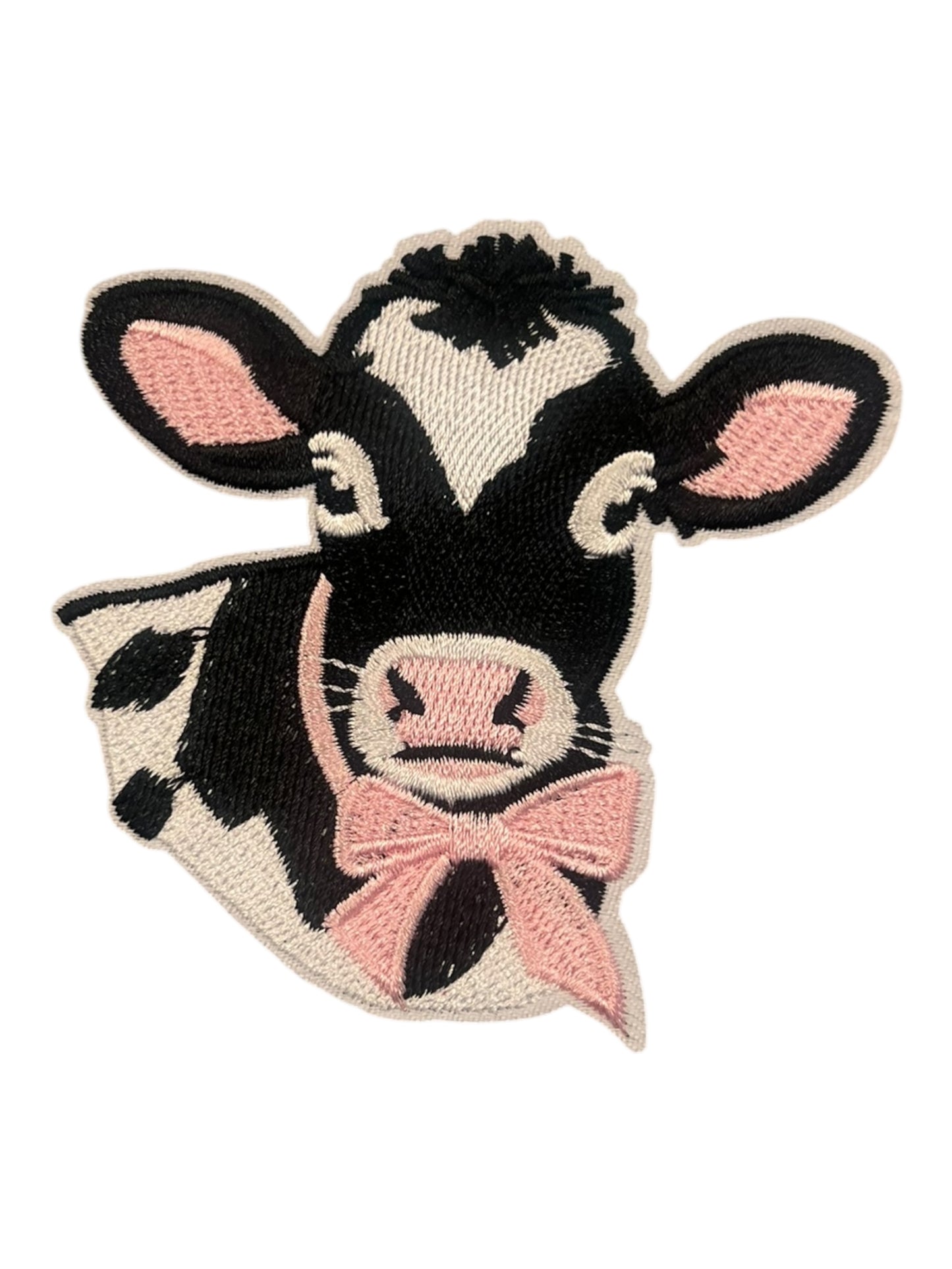 Cow with pink ribbon