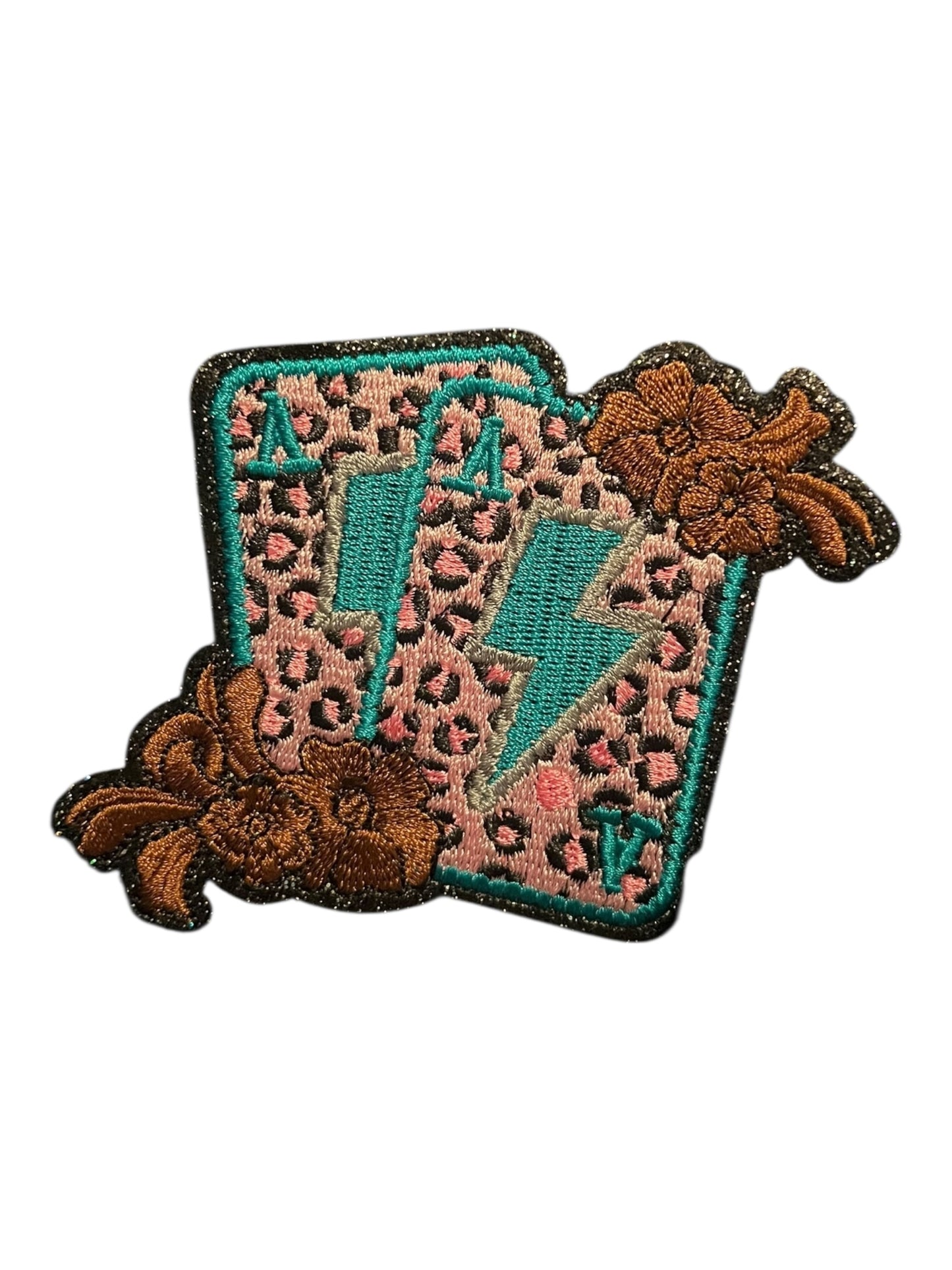 Pink leopard aces with lightning bolts and brown bows