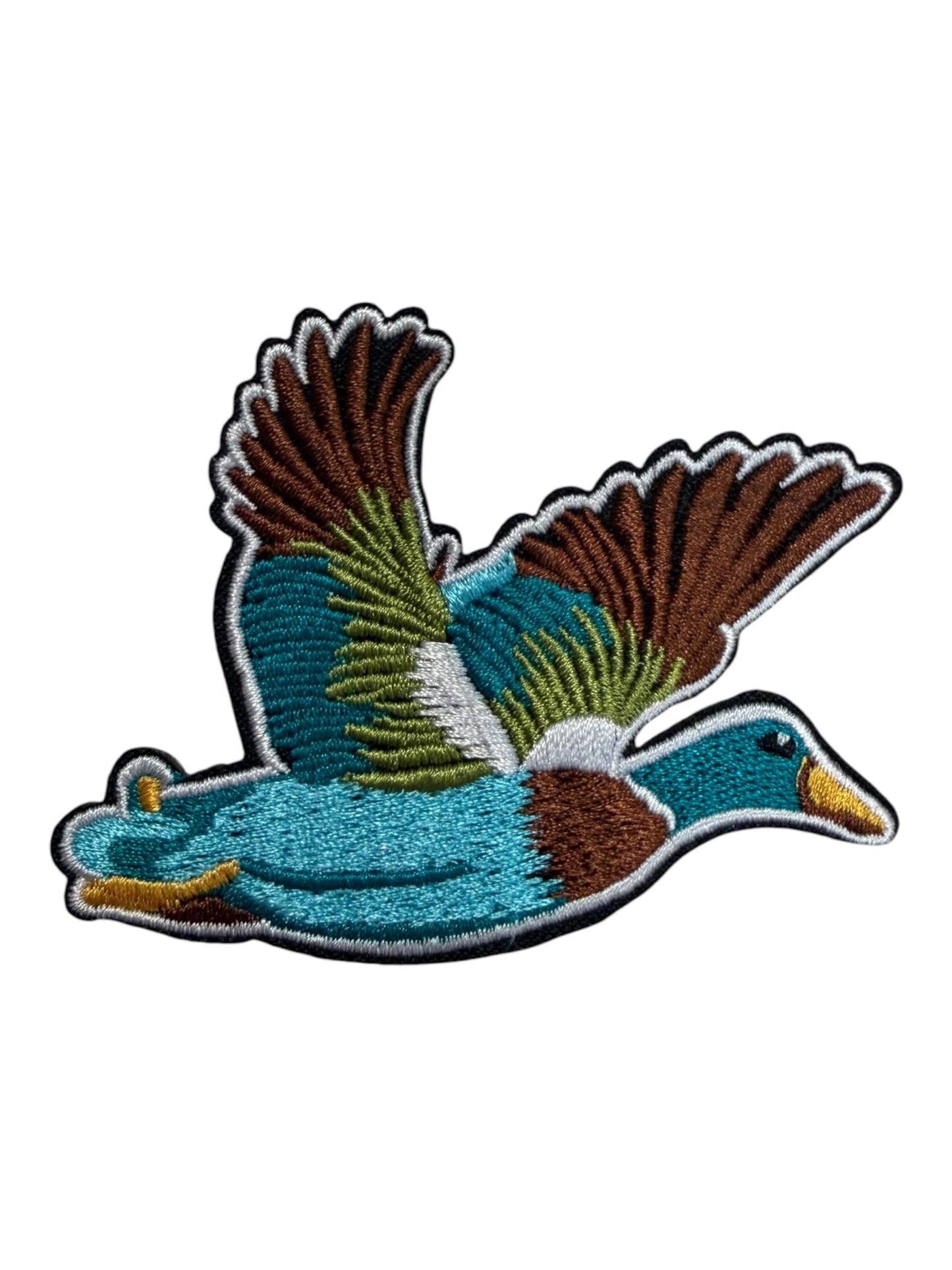 Duck in flight turquoise brown