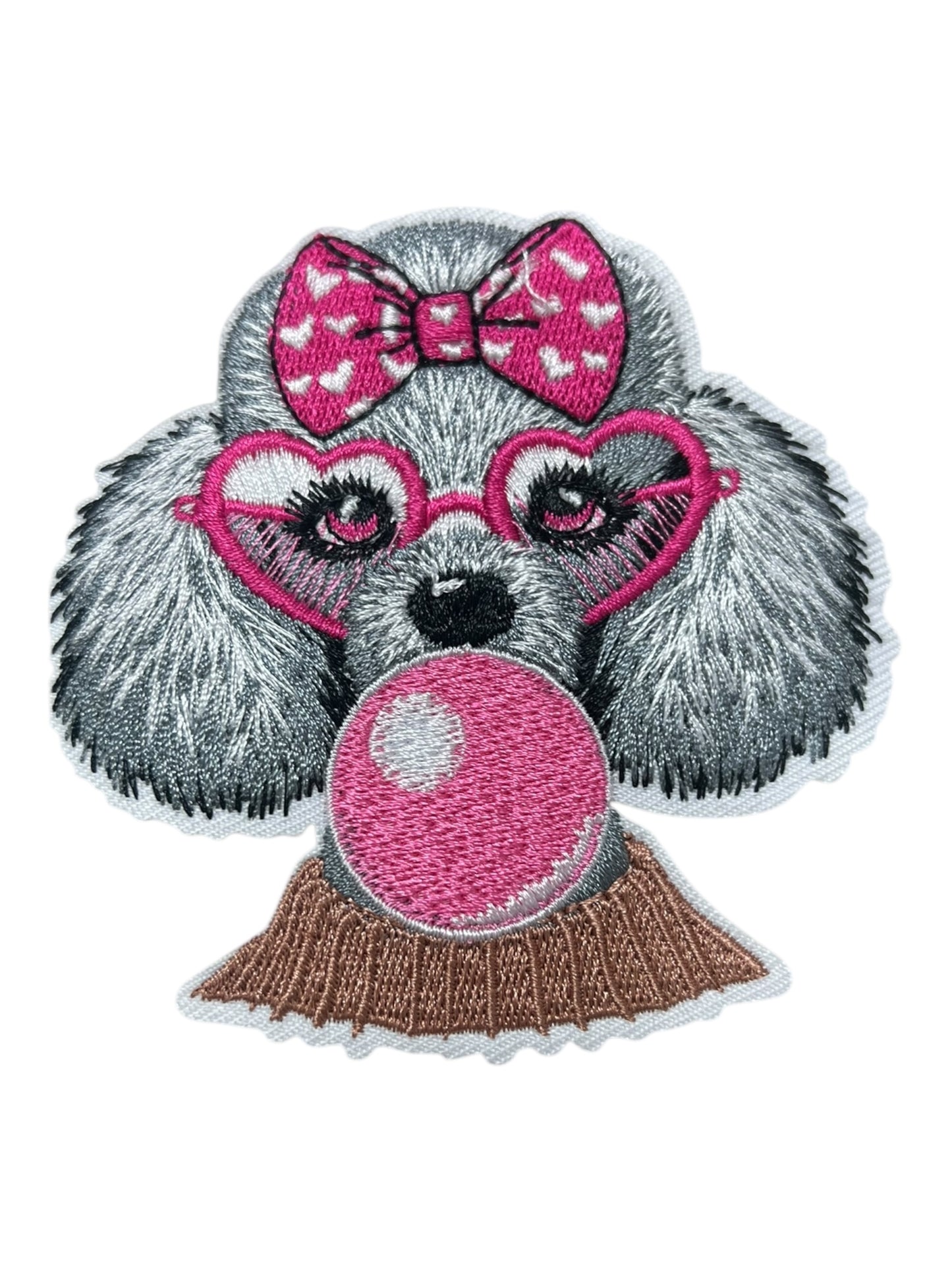 Poodle with pink bubble and bow
