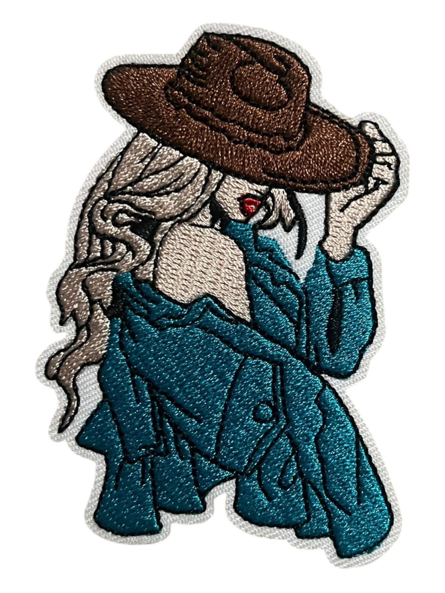 Blonde cowgirl with turquoise and a brown hat