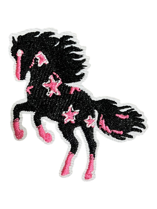 Black horse with pink stars