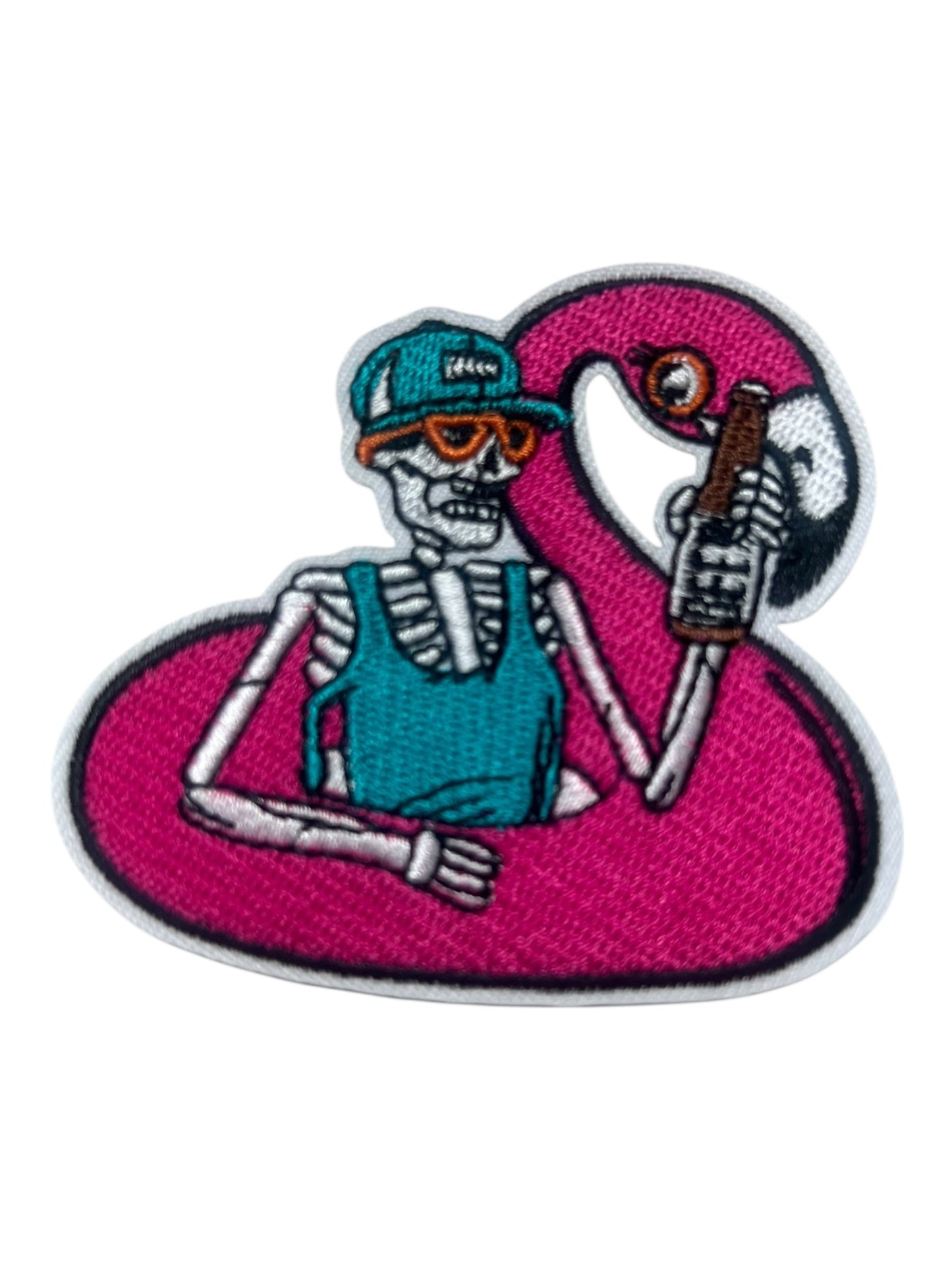 Skelly and beer in a floating flamingo