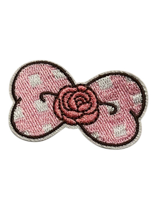 Small pink bow with rose