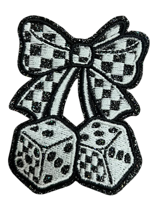 Black  and white dice with checkered bow