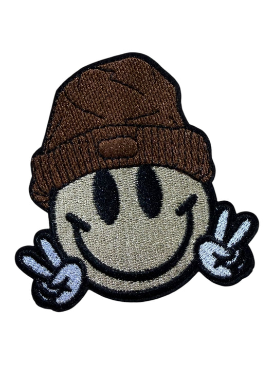 Smiley face peace out  with a beanie