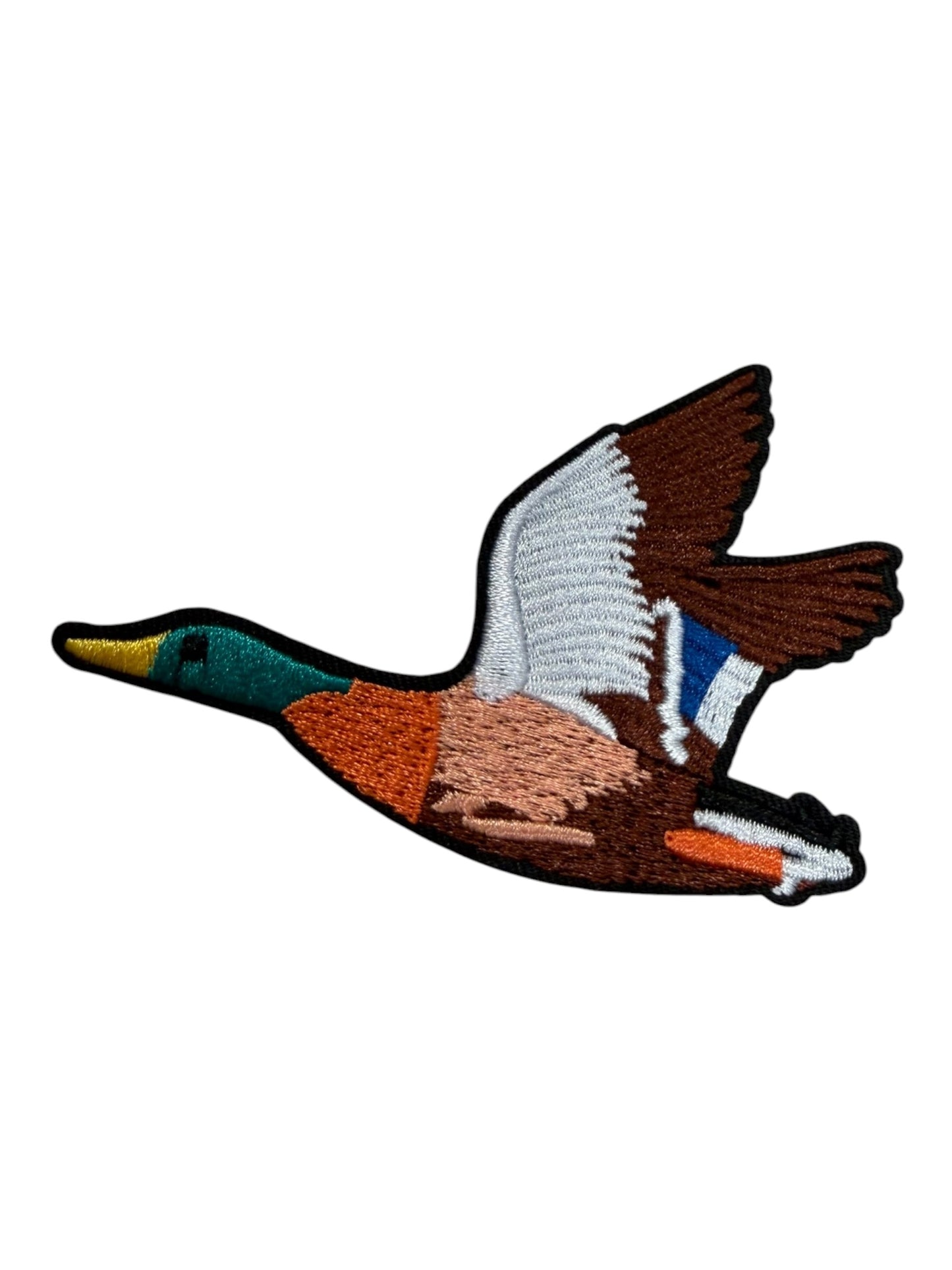 Duck in flight orange green brown