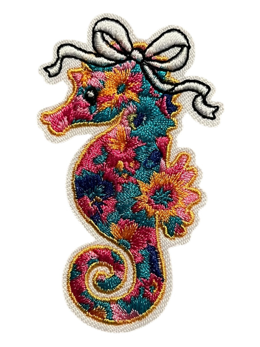 Colorful seahorse with bow