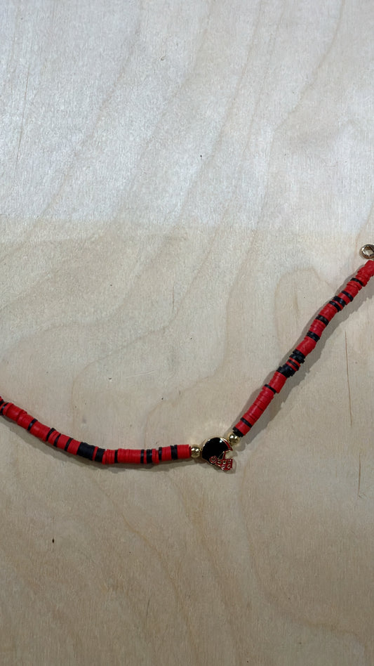 Red and black disc bead hat chain with football