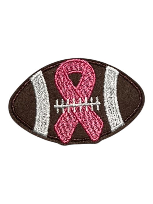 Football with pink breast cancer bow