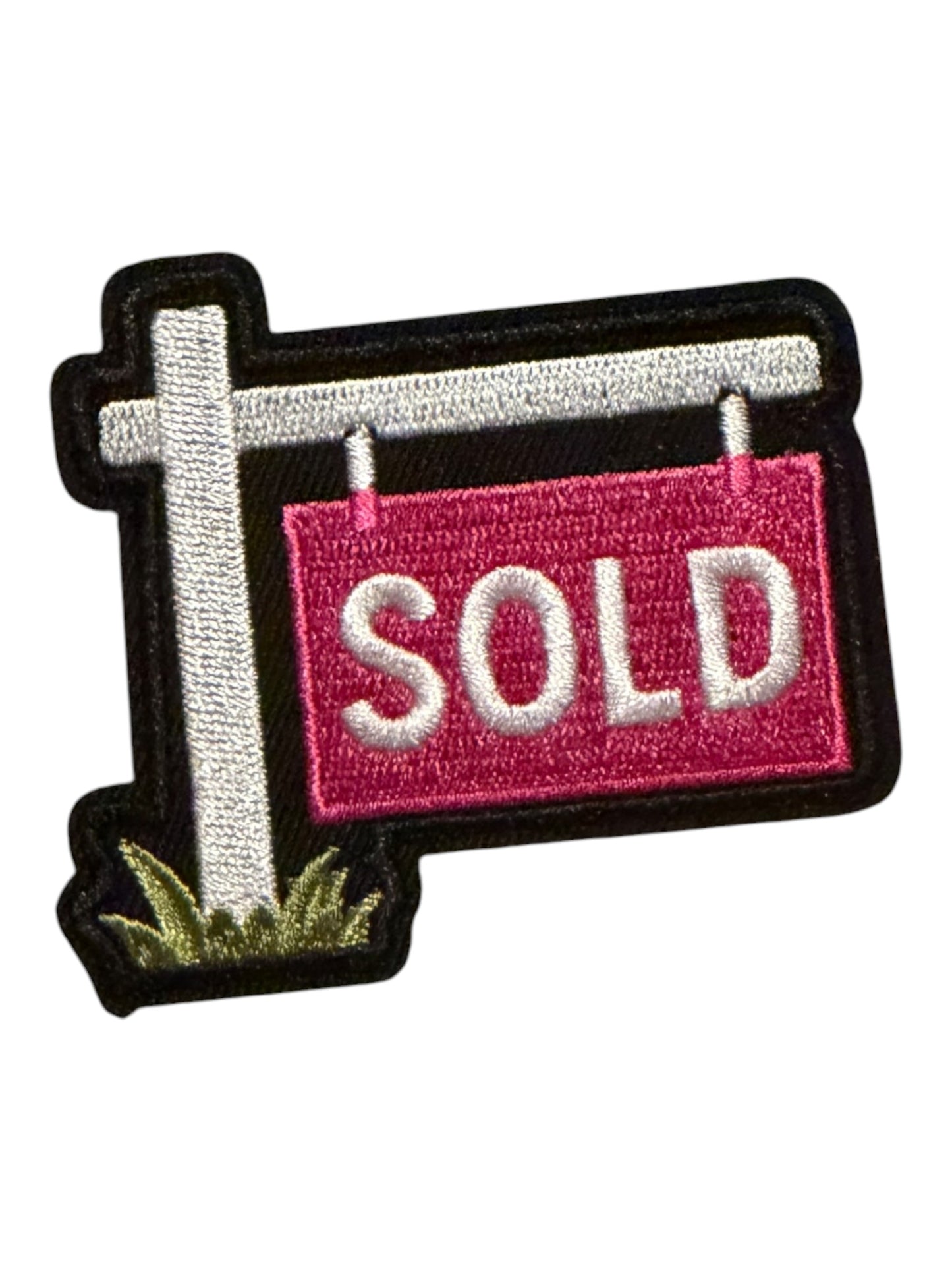 Sold sign pink