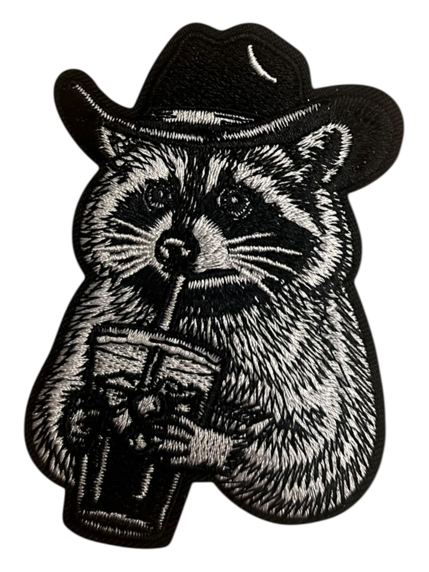 Raccoon with iced coffee