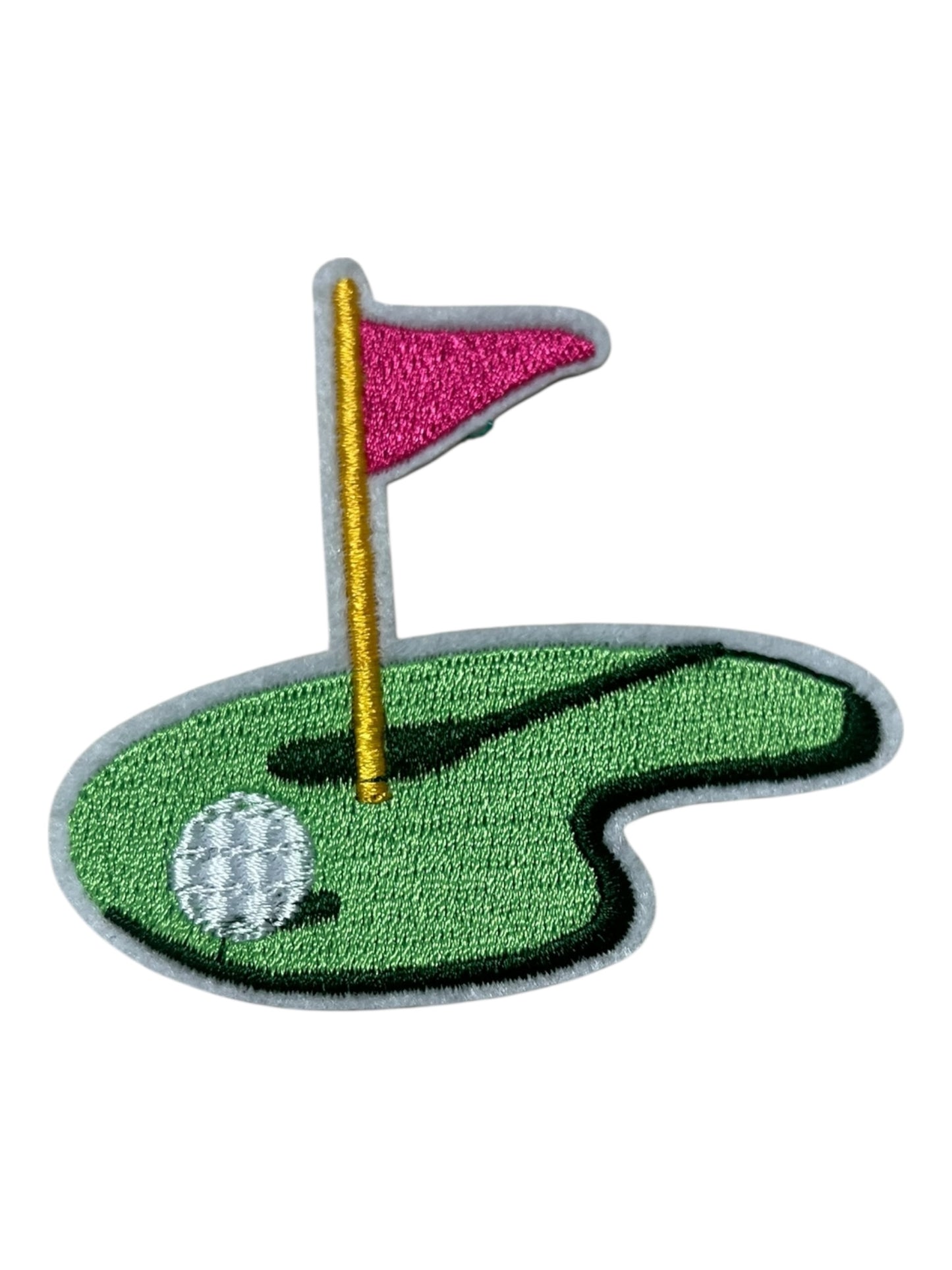 Golf green pink flag