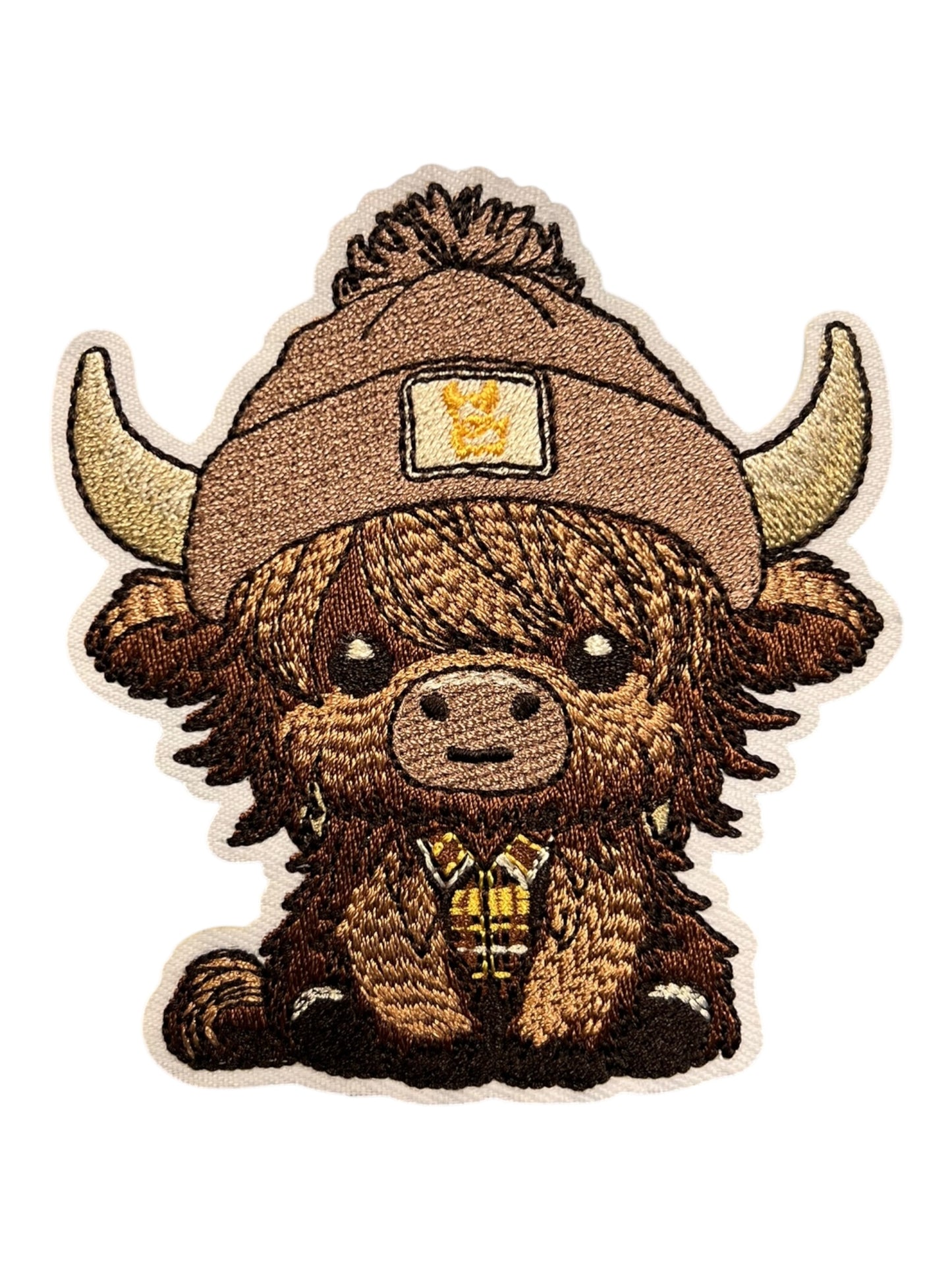 Cow with brown beanie