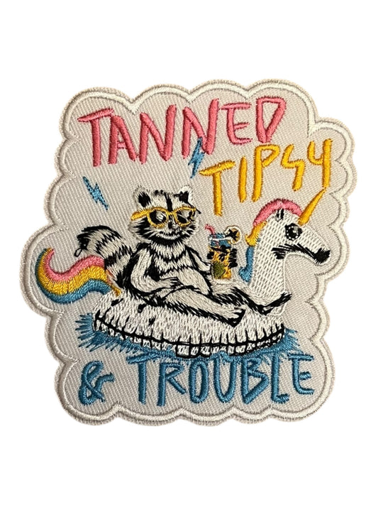 Tanned Tipsy and Trouble