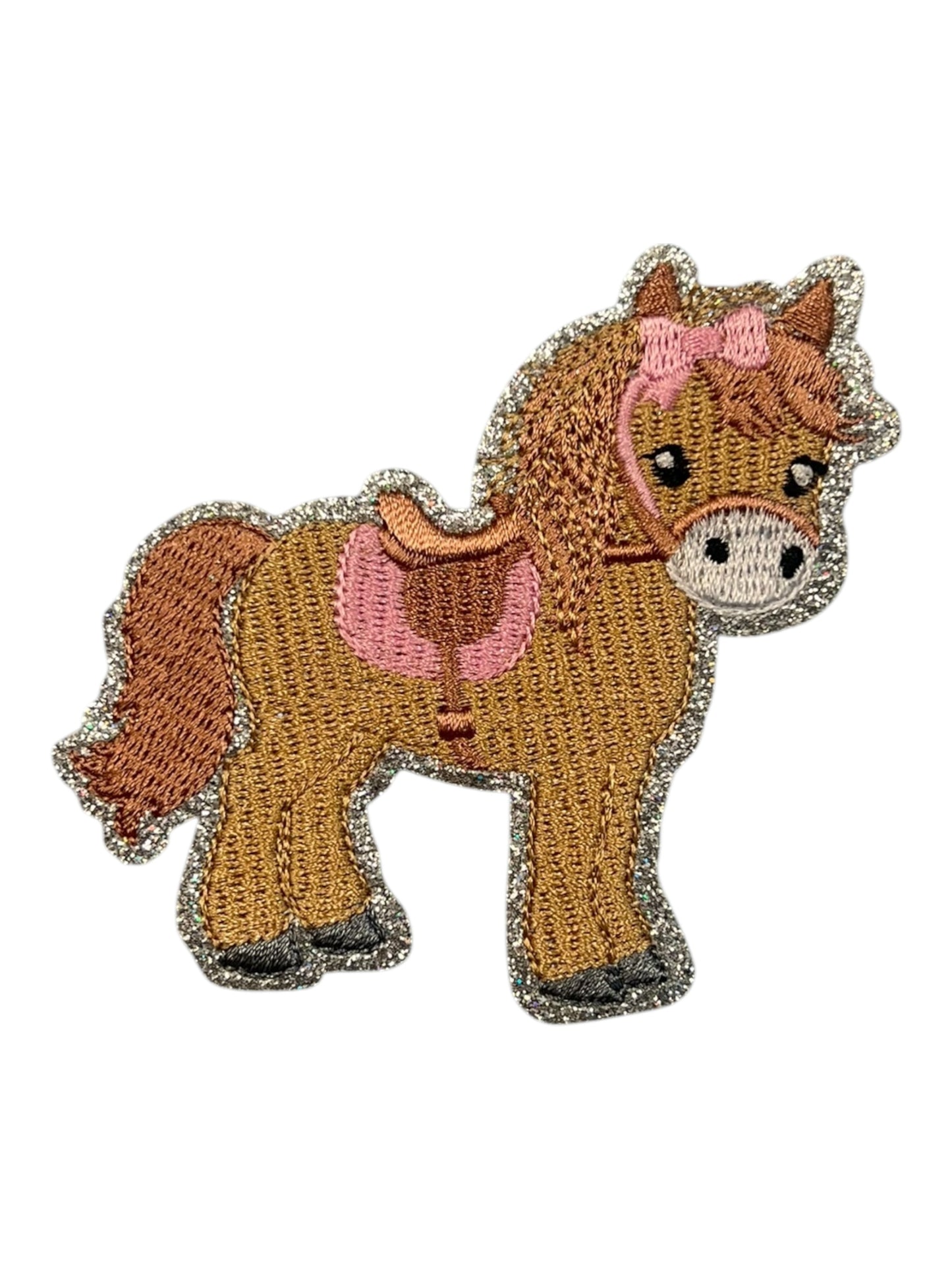 Pony with pink saddle