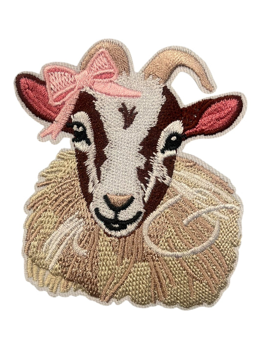 Goat with pink ribbon