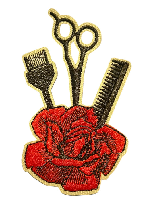 Red rose with stylist tools
