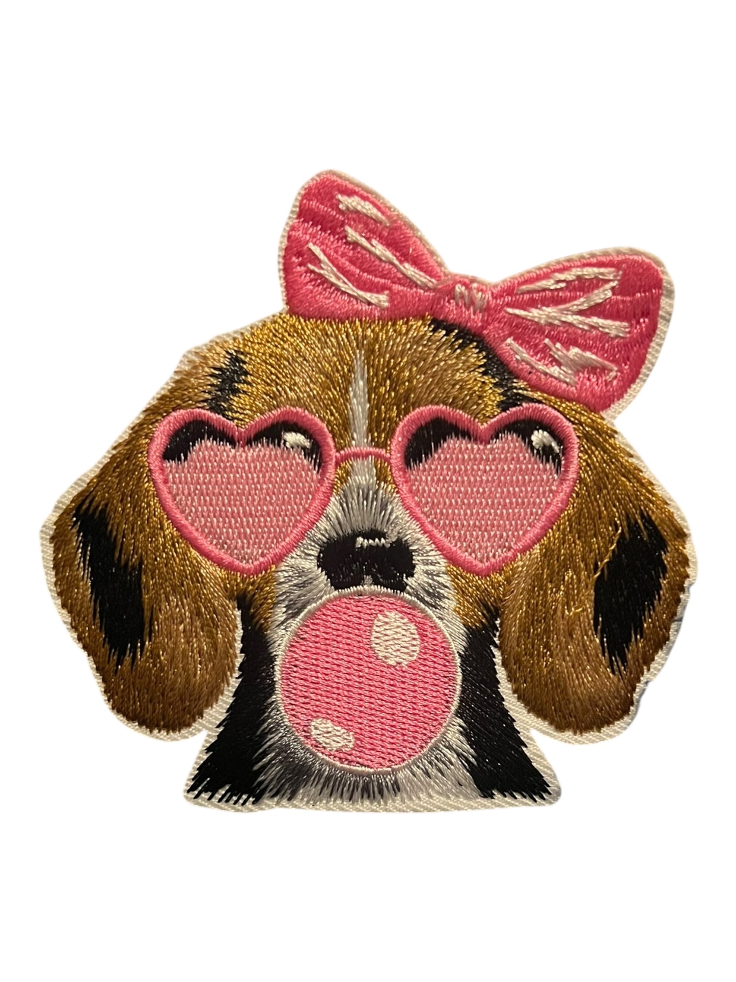 Dog with pink bow and glasses