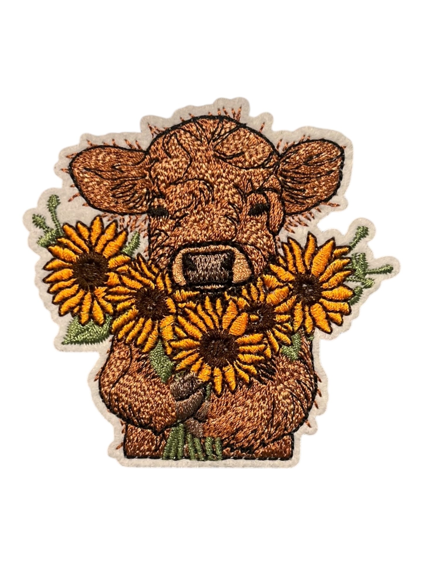 Cow with sunflowers