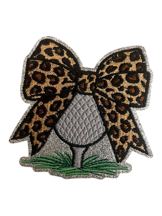 Golf ball with leopard bow
