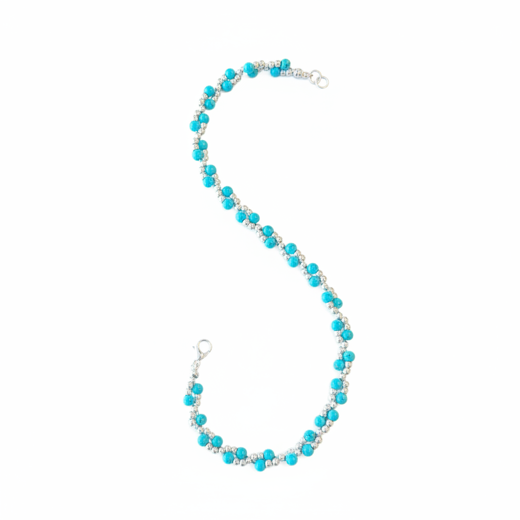 Turquoise and silver hat chain center zoomed close-up